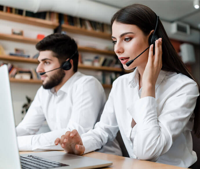 Two people wearing headset giving services